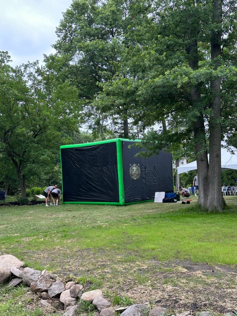 Fore-Play Golf inflatable simulator being set up for a Pearl River graduation party.